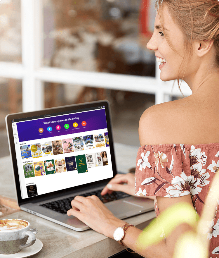 Woman working on laptop in a cafe